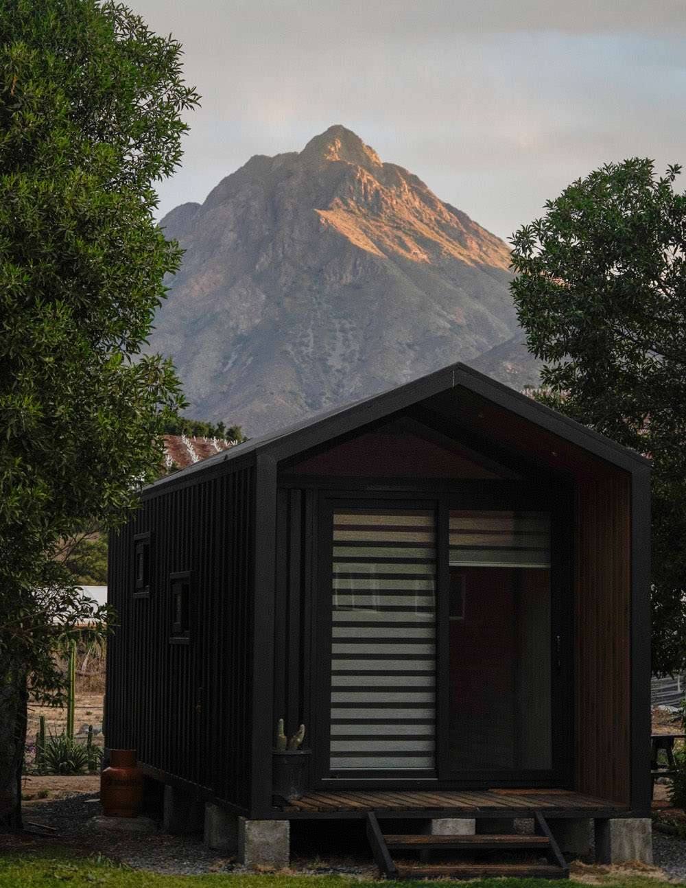 Tiny house exterior with La Campana in the background